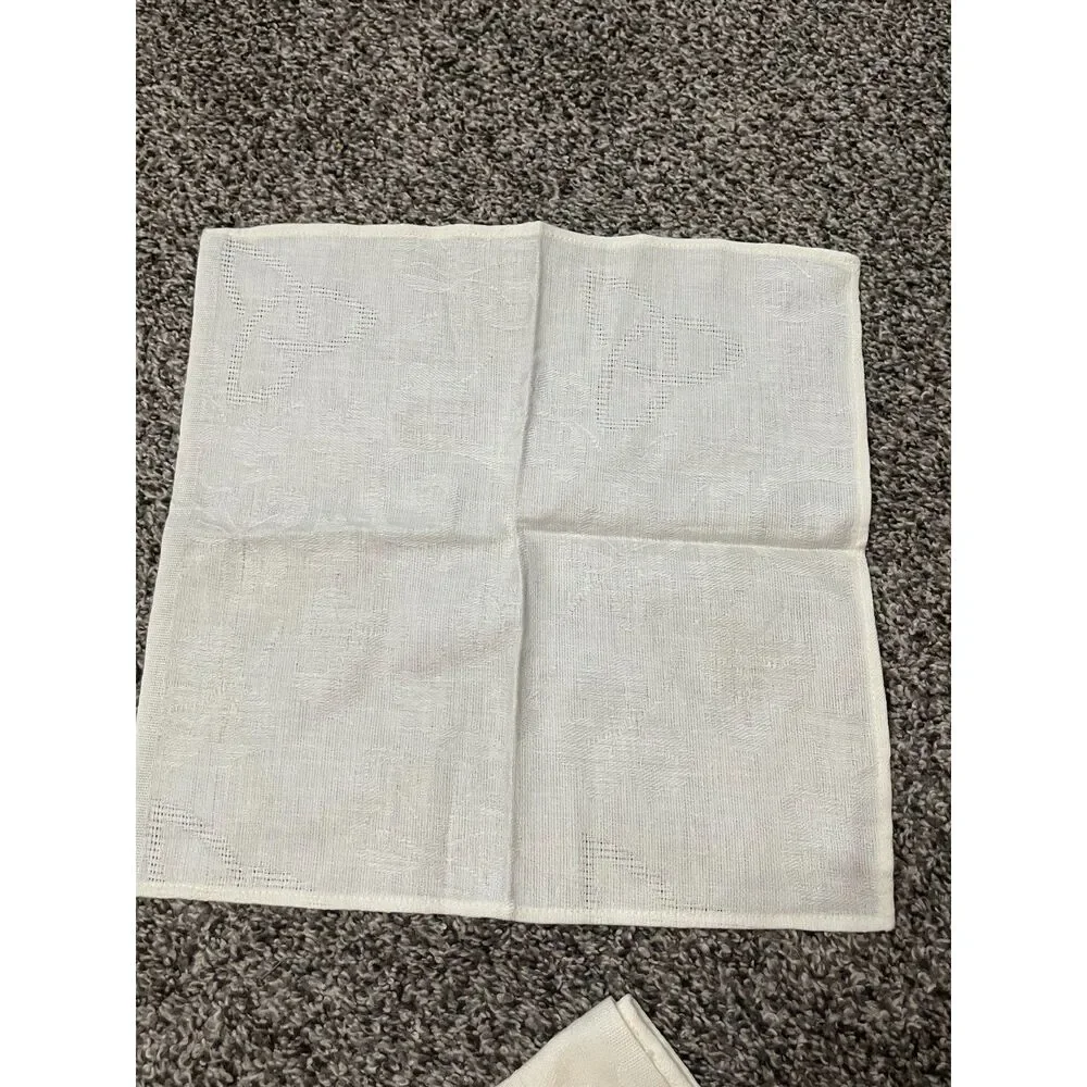 4 ivory damask dinner napkins with subtle leaf pattern